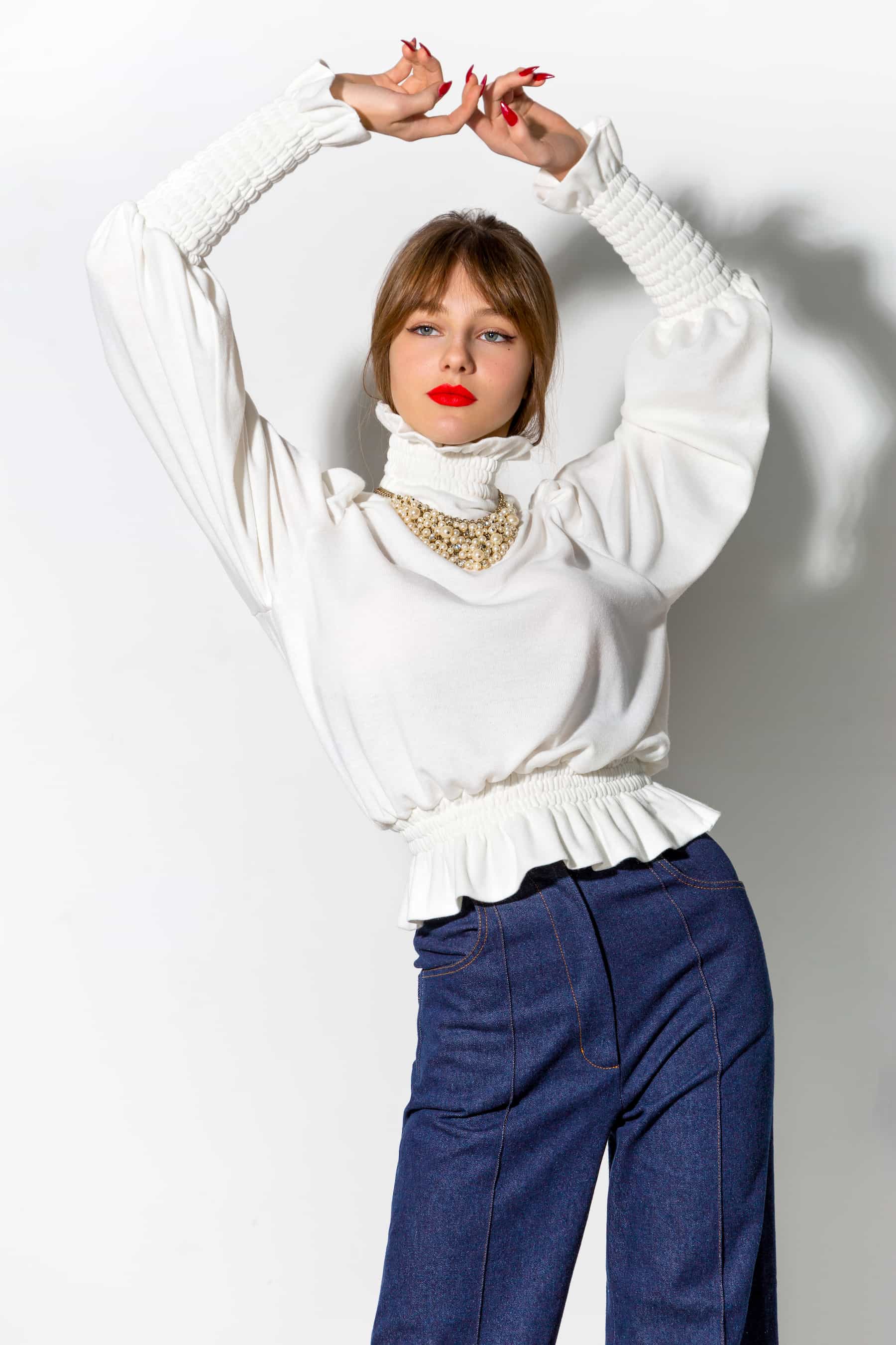 White sweater with stand-up collar and high cuffs